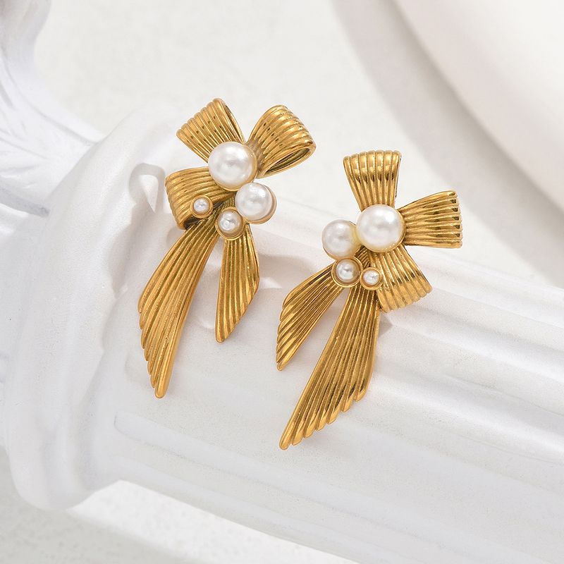 Orecchini a forma di fiocco in stile lusso con luce di nicchia personalizzata, semplici orecchini con texture di perle intarsiate, orecchini temperamento_voghion.com