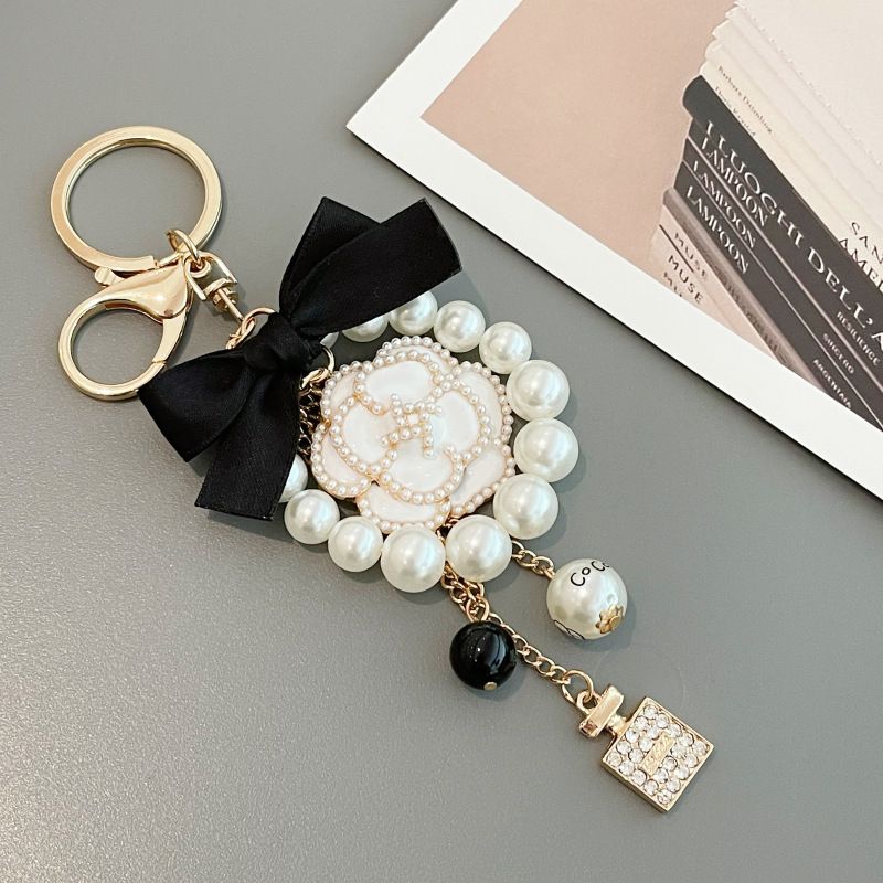 Korean Creative New Drip Oil Mountain Camellia Keychain Exquisite Bow Pearl Chain Bag Hanging Accessories_voghion.com