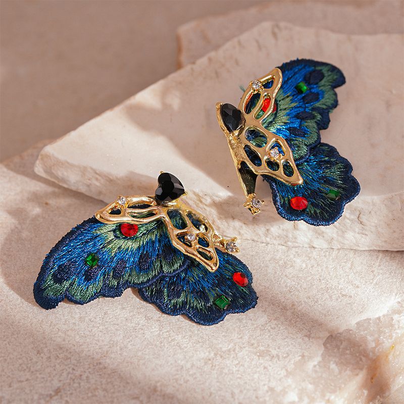 Orecchini a forma di farfalla intrecciata in pizzo con diamanti vintage e ago in argento_voghion.com
