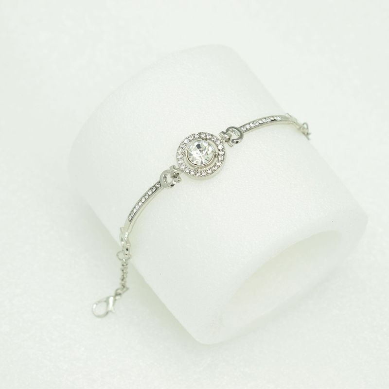 Bracciale alla moda, versatile, grande, a corona, semplice, elegante, nobile, lucido, con diamanti._voghion.com