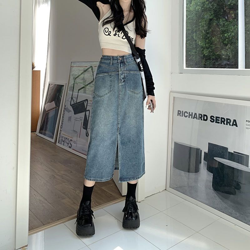 Gonna in denim a vita alta con tasca e design di nicchia per Instagram alla moda da donna, con spacco a metà trapezio, con fianchi avvolti, lunghezza media_voghion.com