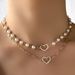 Collana girocollo con elegante perla e ciondolo a forma di cuore cavo, semplice e multistrato, per donna._voghion.com