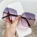 New frameless cut edge women's fashion, with a large metal frame and gradient purple light sunglasses for driving_voghion.com