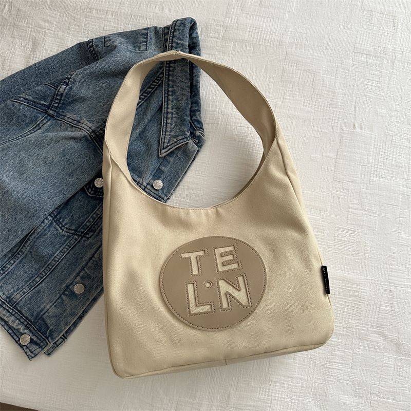 2024 Spring New Beautiful Leisure Personalized Large Capacity Canvas Tote Women's Fashion Single Shoulder Commuter Bag_voghion.com