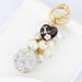Exquisite diamond studded round pearl string small fragrance keychain clothes 5-character metal decoration bag pendant_voghion.com
