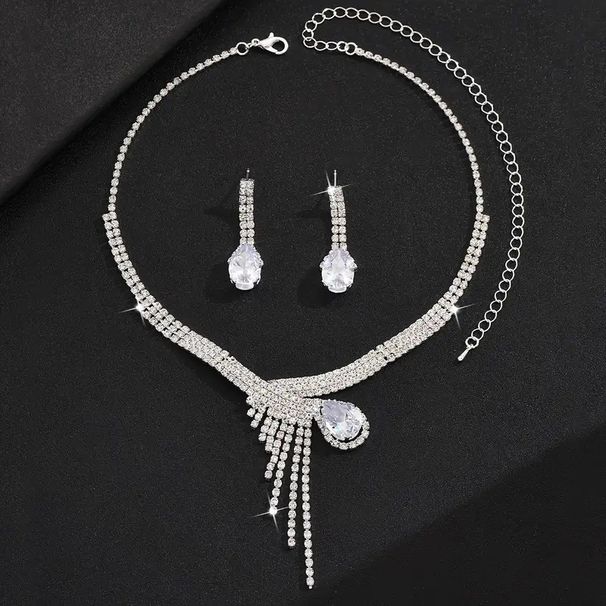 Collana orecchini bracciale con zirconi a goccia intarsiati di lusso e borsa da sera lucida, abito da banchetto in quattro pezzi_voghion.com