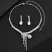 Collana orecchini bracciale con zirconi a goccia intarsiati di lusso e borsa da sera lucida, abito da banchetto in quattro pezzi_voghion.com