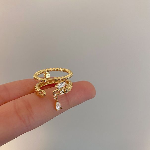 Goldfarbener, geflochtener Doppelring für Damen – Hohlzirkon-Detail, leichtes, luxuriöses Nischen-Zeigefinger-Design, verkupfert_voghion.com