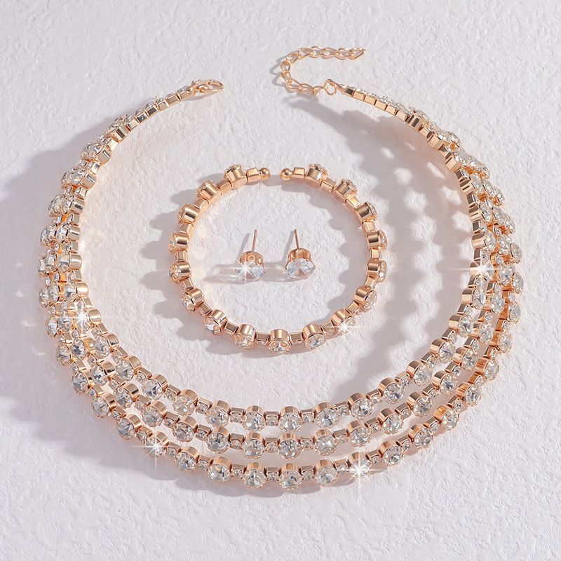 Bijoux de mariée Collier Boucles d'oreilles Bracelet Ensemble de mariage trois pièces Robe de soirée Accessoires de mode pour femmes_voghion.com