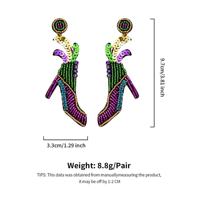 Boucles d'oreilles de festival de carnaval de style ethnique automne et hiver boucles d'oreilles exagérées de plumes de perles de riz faites à la main de mode haut de gamme pour femmes_voghion.com