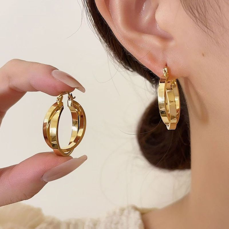 A pair of European and American cold wind cross circle ear buckle simple everything temperament ear_voghion.com