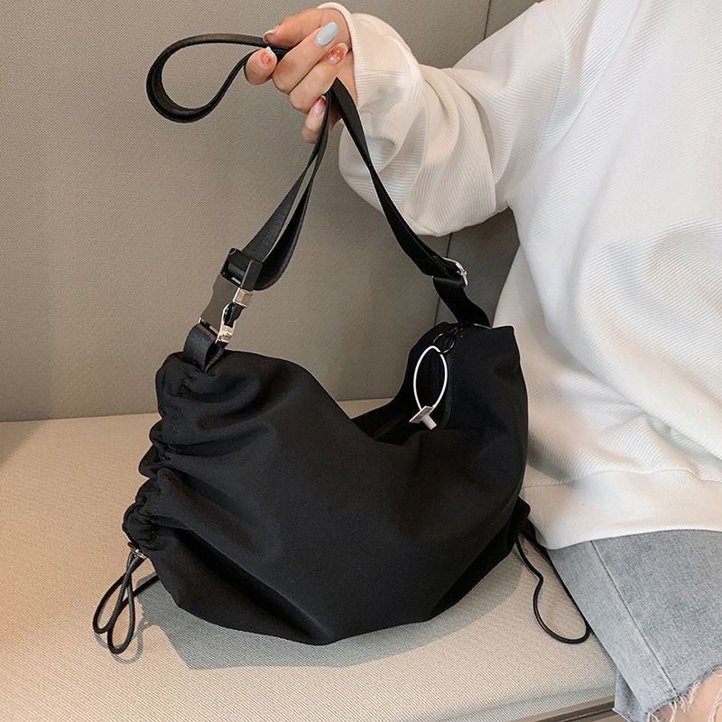 Korean Version 2023 New Trendy Simple Daily Drawstring Commuter Satchel Wholesale Net Red Live Broadcast Solid Color_voghion.com
