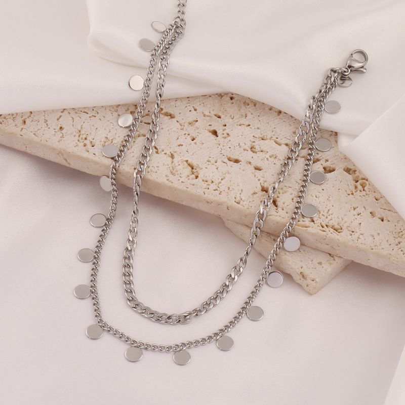 Cavigliera a doppio strato da spiaggia in acciaio inossidabile placcato oro con nappa rotonda per donna, design alla moda_voghion.com