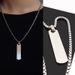 Minimalistisk motemerke tredimensjonalt langt rustfritt stålkjede for menns Instagram-stil nisjedesign-anheng_voghion.com