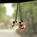 Colgante de cristal para interior de coche, pequeño y fresco, con forma de botella de perfume artística._voghion.com