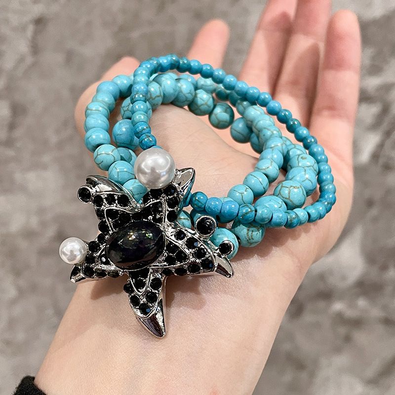 Bracciale in turchese in stile vintage con diamanti e perle pesanti a forma di stella marina_voghion.com