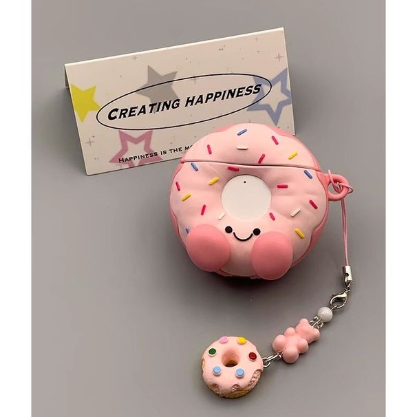 O pingente em formato de rosquinha rosa, macio e fofo, é perfeito para as capas dos fones de ouvido sem fio AirPods 4 da Apple._voghion.com