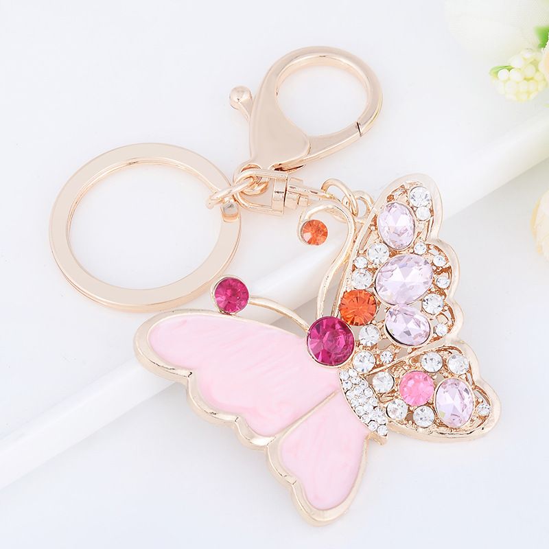 Chaveiro com pingente de bolsa de carro em forma de borboleta rosa com incrustações de diamantes e gotas de óleo, presente pequeno e requintado_voghion.com