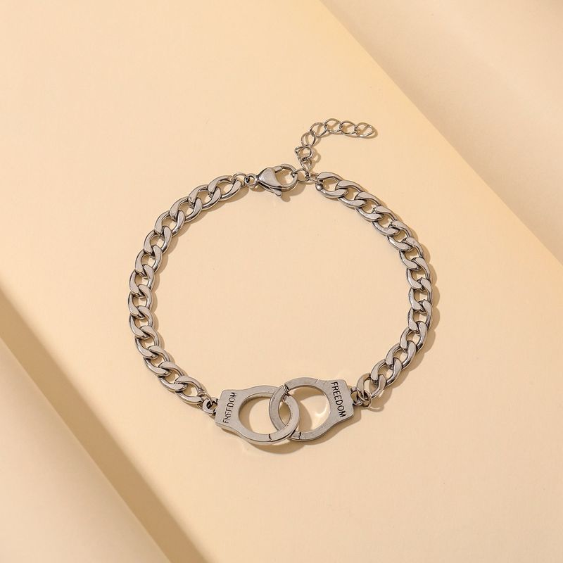 Braccialetto di coppia alla moda con manette in acciaio inossidabile, minimalista, hip-hop, semplice e creativo, con incisione "Freedom"._voghion.com