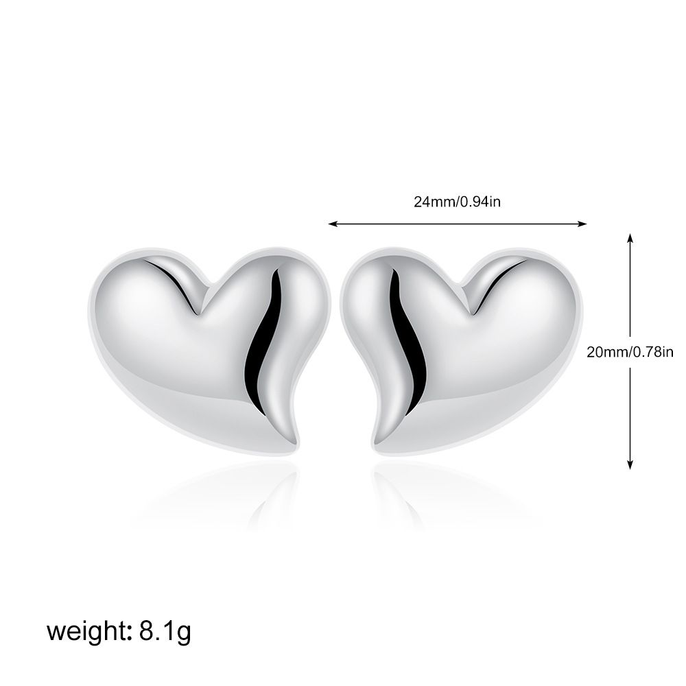 Orecchini unisex di alta moda, di nicchia, versatili, con cuore in oro e argento lucido._voghion.com