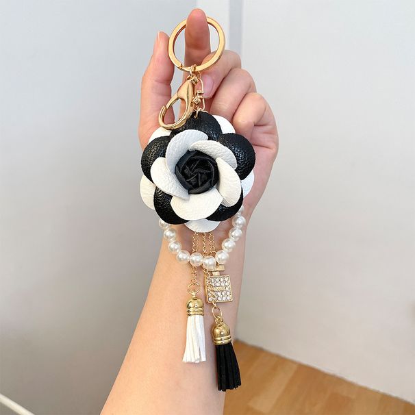 Portachiavi per auto con bottiglia di profumo in filo di perle di camelia bianca e nera, stile coreano, ciondolo per borsa da donna, piccolo_voghion.com
