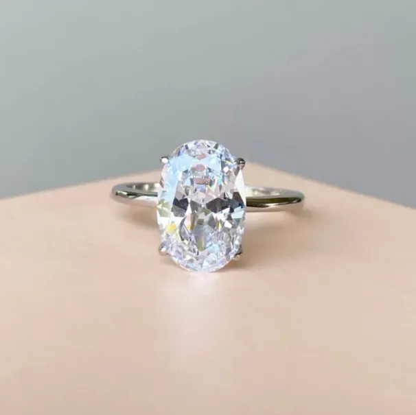 Žhavé výprodeje Žhavé výprodeje Oslnivé oválné geometrické zlaté prsteny Sier Color pro ženy Módní kovové intarzované bílé kameny Prstenové šperky_voghion.com