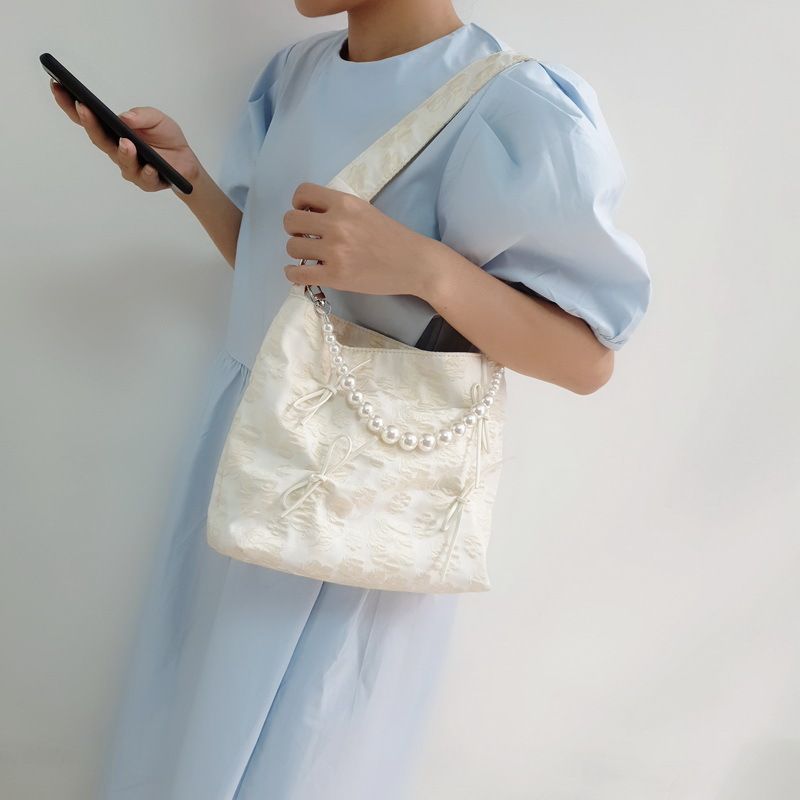 Borsa a tracolla singola diagonale con fiocco in perla, alla moda, nuova primavera/estate 2024, in jacquard, unica_voghion.com