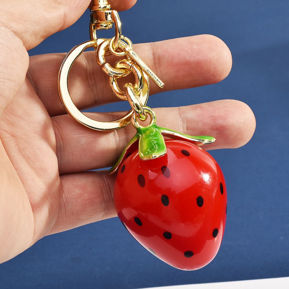 Portachiavi per auto con ciondolo a forma di borsa in resina con motivo a fragola, avocado e cartone animato._voghion.com