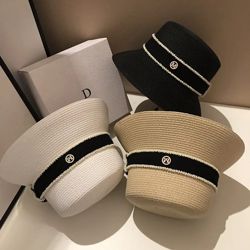 Gorąca sprzedaż Gorąca sprzedaż Nowe letnie słomkowe kapelusze przeciwsłoneczne dla kobiet Moda damska Płaskie rondo Wstążka Plażowa Czapka podróżna Chapeau Femme Kapelusz typu Bucket_voghion.com