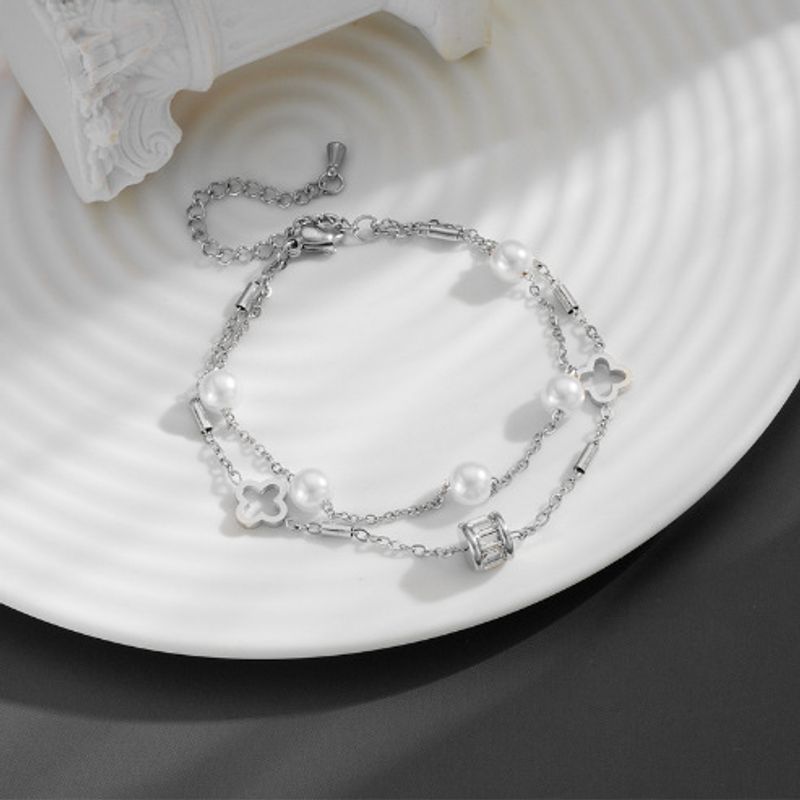 Bracciale doppio strato multi-perla bianca con ciondolo portafortuna in acciaio al titanio per donna_voghion.com