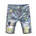 Pantaloncini estivi alla moda con colori a contrasto, jeans strappati da uomo, pantaloncini larghi con schizzi d'inchiostro alla moda._voghion.com