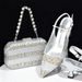 Accessorize the evening with shredded diamond embellished high-heeled sandals and a hard-box handbag set_voghion.com