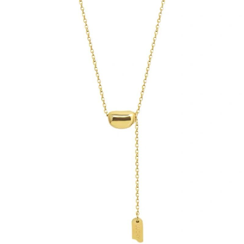 Trendigt halsband med litet tofs i guld med bönor i titanstål, enkelt lyxigt temperament, trendig och nischad design för tjejer_voghion.com