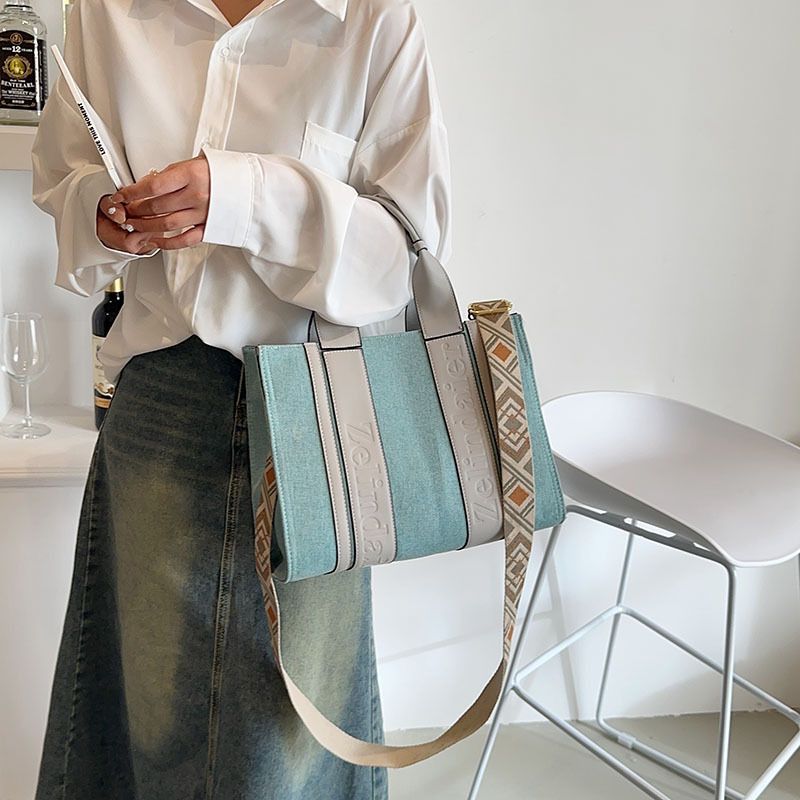 Einkaufstasche Neue Leinwand Farbe Kontrast Große Kapazität Tasche frauen 2023 Trendy mode hohe gefühl arbeit pendeln Messenger tasche_voghion.com