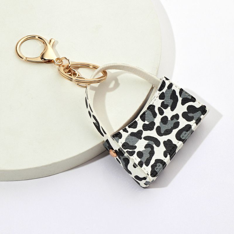 Taschenanhänger mit Leopardenmuster, kleiner, gebogener Taschen-Schlüsselanhänger, PU-Leder, Geldbörse, Schlüsselanhänger, grenzüberschreitender Autotaschen-Anhänger, Zubehör_voghion.com