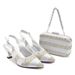 Accessorize the evening with shredded diamond embellished high-heeled sandals and a hard-box handbag set_voghion.com