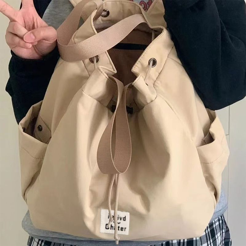 Ins Simple Großer Freizeitrucksack Vielseitige High-End-Pendlertasche mit Kordelzug Damen Einfarbige Handtasche_voghion.com