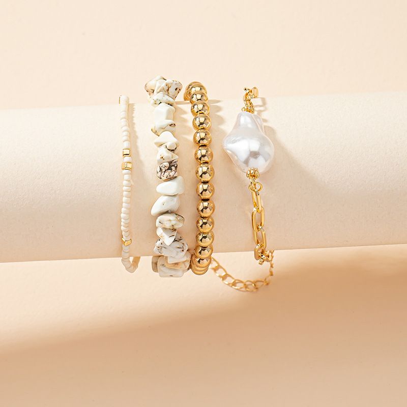 Bracciale elastico con perline di riso, design di lusso leggero e 4 pietre irregolari, 2022_voghion.com