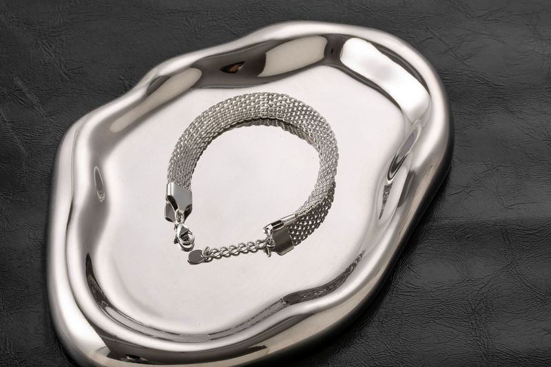 Bracciale unisex in oro con catena piatta in acciaio inossidabile intrecciata al titanio e resistente alla luce_voghion.com