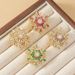 Women's Brooch Snowflake Zircon Rotatable Brooch Three Dimensional Corsage Women's Temperament Suit Coat Pin Buckle_voghion.com
