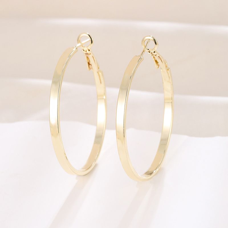 Orecchini piatti esagerati in metallo con cerchio liscio classico Silver Needle_voghion.com