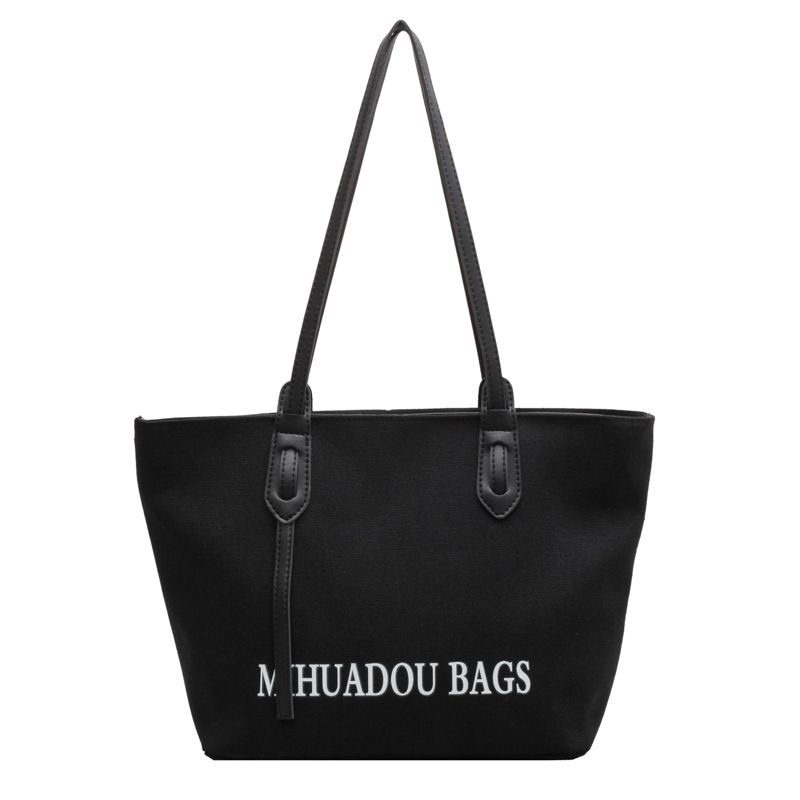Canvas Large Bag Women 2023 New Fashion Commuter Shoulder Bag Solid Color letter style urban simple tote bag_voghion.com