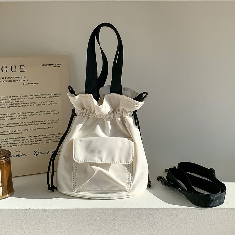 Borsa piccola in tela solida con bocca a secchiello portatile in tessuto Oxford con coulisse, in una semplice borsa a tracolla monospalla_voghion.com