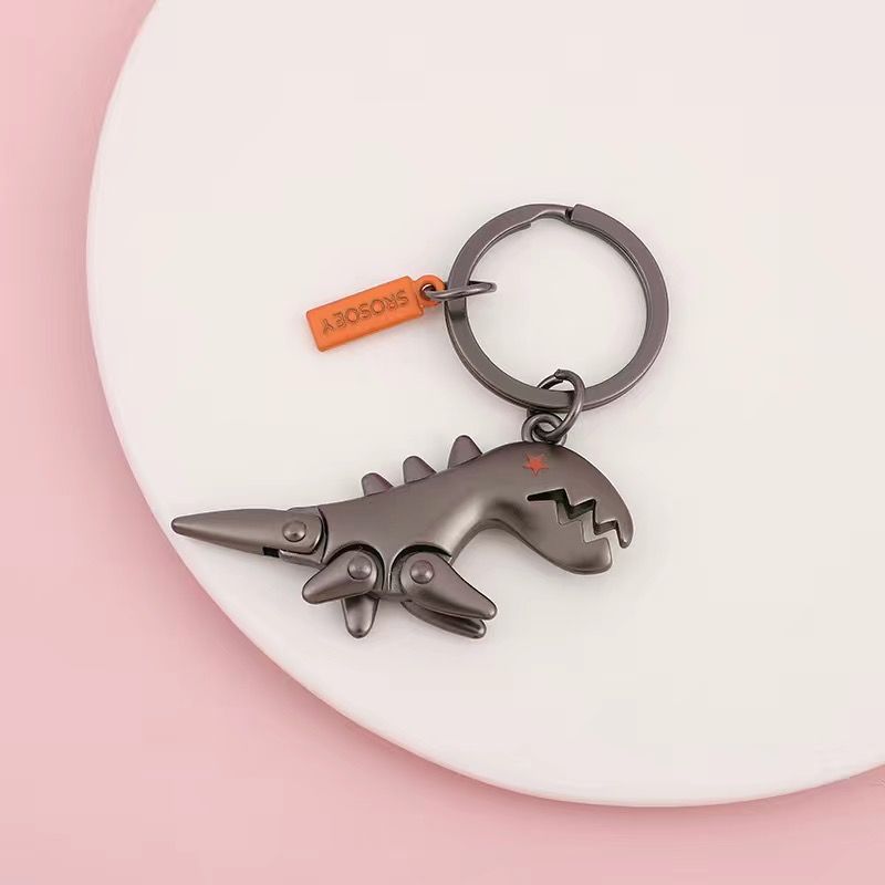 Kleiner Dinosaurier-Leder-Autoschlüssel-Schlüsselanhänger-Anhänger Damen-Schlüsselanhänger Kreativer High-End-Puppen-Hufeisenschnallen-Netz-Promi-Anhänger_voghion.com