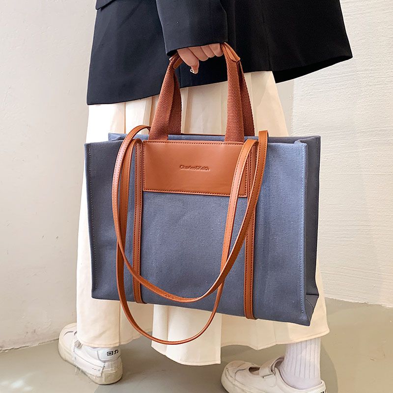 Canvas-Tasche Großhandel große Kapazität kontrastierende Umhängetasche 2023 grenzüberschreitende neue Handtasche trendige Mode-Einkaufstasche_voghion.com