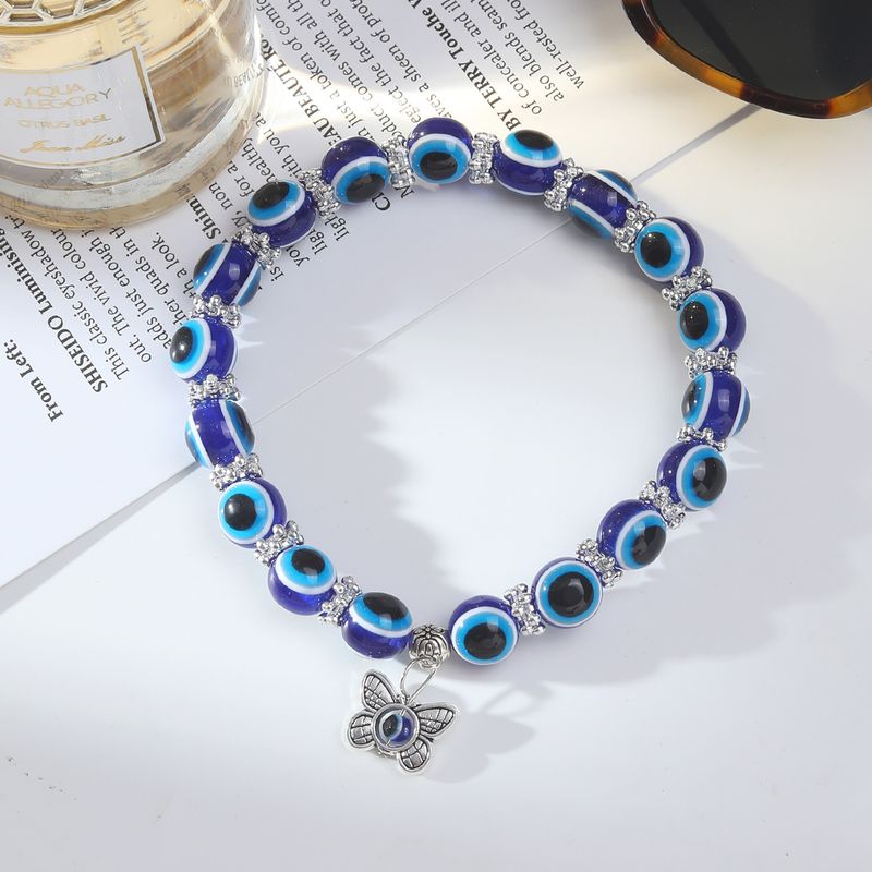 Bracciale alla caviglia con nappa e ciondolo a forma di occhio del diavolo, due in uno, in lega, per l'estate e la spiaggia._voghion.com