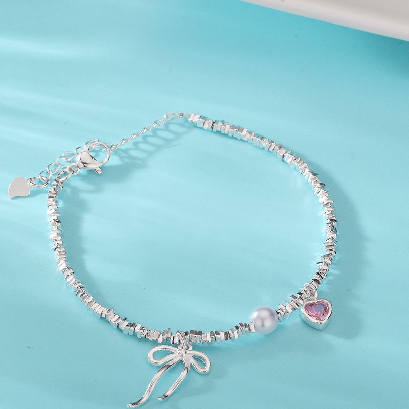 Bracciale patchwork con cuore e fiocco in argento con frammenti di perle irregolari in stile coreano, design di nicchia, gioielli versatili di alta gamma_voghion.com