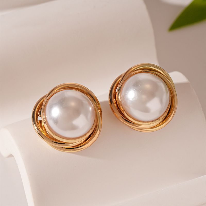 Retro pearllike round geometric winding steel needle stud earrings fashionable simple high-end earrings_voghion.com