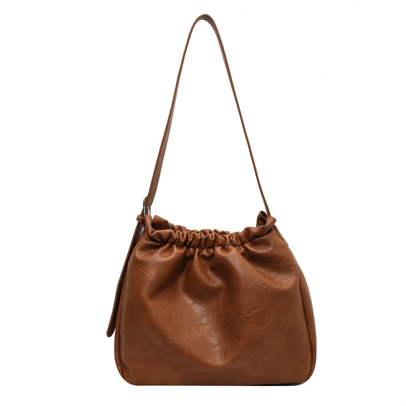 Korean Version Of The Simple Commuter Large-capacity Bag Female 2023 New Retro Texture Shoulder Bag Versatile Bucket Tote Bag_voghion.com