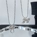 Collana con catena a maglioni di perle dinamiche con fiocco in nastro d'argento opaco placcato in argento coreano autunnale per donne di alta qualità_voghion.com